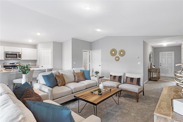 10539 Kidron Ave, Englewood, FL 34224 - living room with light carpet, baseboards, recessed lighting, and vaulted ceiling