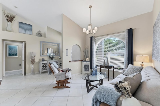 4585 Dover Street Cir E, Bradenton, FL 34203 - living room featuring a chandelier, baseboards, light tile patterned floors, and high vaulted ceiling