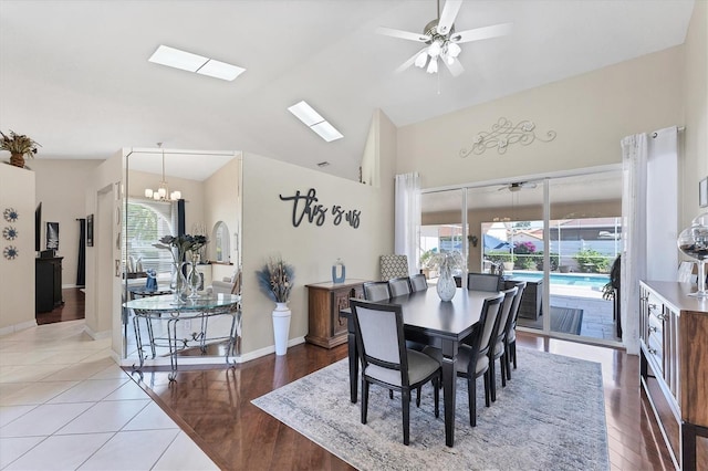 4585 Dover Street Cir E, Bradenton, FL 34203 - dining area featuring a ceiling fan, lofted ceiling, a chandelier, baseboards, and tile patterned floors