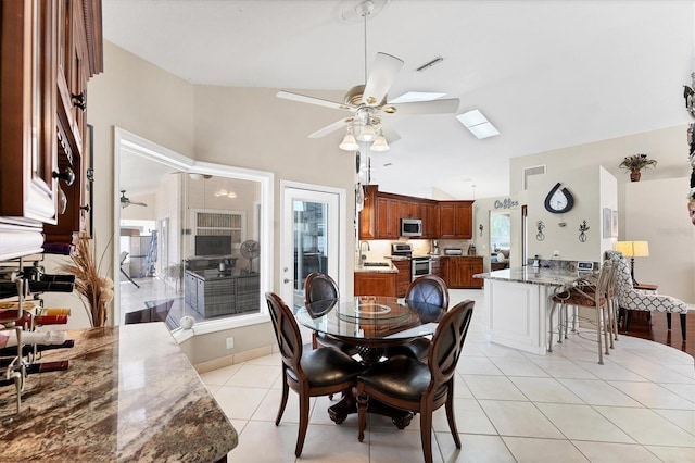 4585 Dover Street Cir E, Bradenton, FL 34203 - dining space with a ceiling fan, light tile patterned flooring, and high vaulted ceiling
