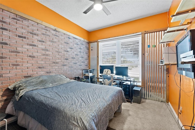 318 39th St NE, Bradenton, FL 34208 - carpeted bedroom featuring a textured ceiling, brick wall, a desk, and ceiling fan