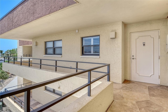 8779 Midnight Pass Rd Unit 506H, Sarasota, FL 34242 - doorway to property with a balcony and stucco siding