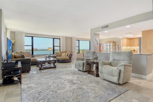 8779 Midnight Pass Rd Unit 506H, Sarasota, FL 34242 - living area with a textured ceiling