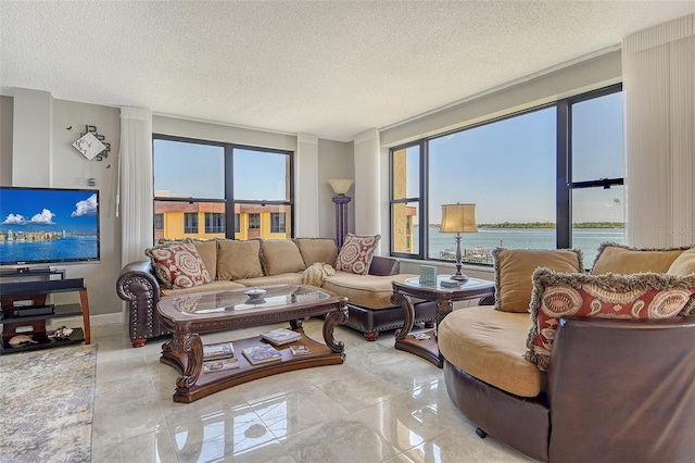 8779 Midnight Pass Rd Unit 506H, Sarasota, FL 34242 - living area featuring a textured ceiling and a water view
