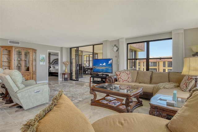 8779 Midnight Pass Rd Unit 506H, Sarasota, FL 34242 - living area with a textured ceiling