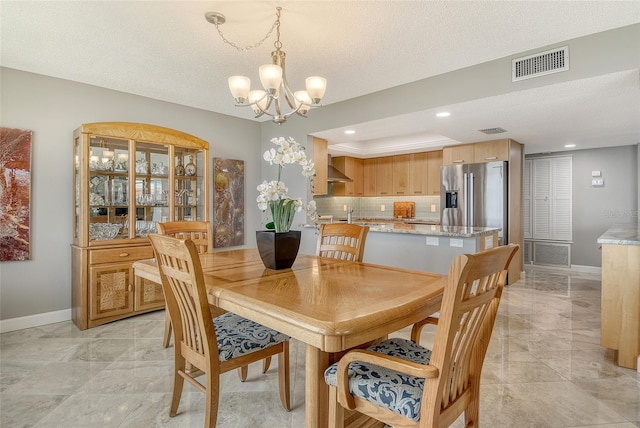 8779 Midnight Pass Rd Unit 506H, Sarasota, FL 34242 - dining room with baseboards, a chandelier, a textured ceiling, and recessed lighting