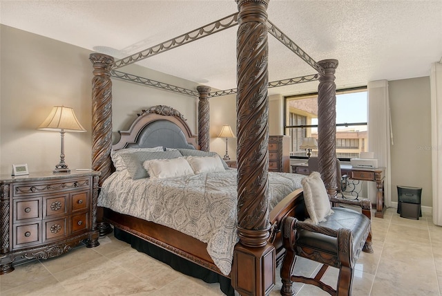 8779 Midnight Pass Rd Unit 506H, Sarasota, FL 34242 - bedroom with a textured ceiling and light tile patterned floors