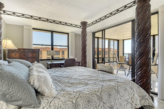 8779 Midnight Pass Rd Unit 506H, Sarasota, FL 34242 - bedroom with a textured ceiling and access to exterior