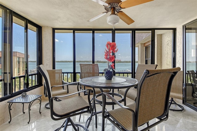 8779 Midnight Pass Rd Unit 506H, Sarasota, FL 34242 - sunroom / solarium featuring expansive windows, a water view, and a textured ceiling