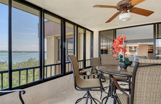 8779 Midnight Pass Rd Unit 506H, Sarasota, FL 34242 - sunroom / solarium featuring a water view and expansive windows