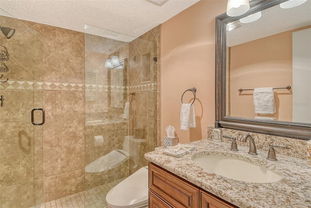 8779 Midnight Pass Rd Unit 506H, Sarasota, FL 34242 - bathroom with a stall shower, a textured ceiling, toilet, and vanity