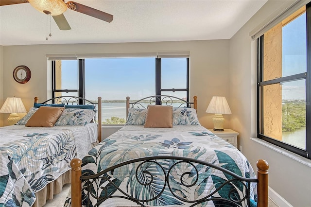 8779 Midnight Pass Rd Unit 506H, Sarasota, FL 34242 - bedroom with baseboards and ceiling fan