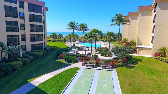 8779 Midnight Pass Rd Unit 506H, Sarasota, FL 34242 - view of home's community featuring shuffleboard and a yard