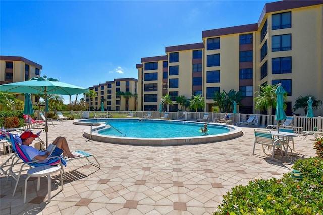 8779 Midnight Pass Rd Unit 506H, Sarasota, FL 34242 - community pool with a patio area and a hot tub