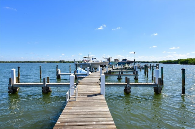8779 Midnight Pass Rd Unit 506H, Sarasota, FL 34242 - dock area with a water view and boat lift
