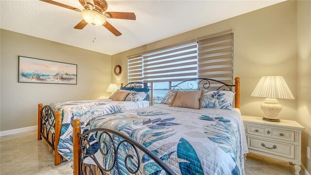 8779 Midnight Pass Rd Unit 506H, Sarasota, FL 34242 - bedroom featuring baseboards and ceiling fan