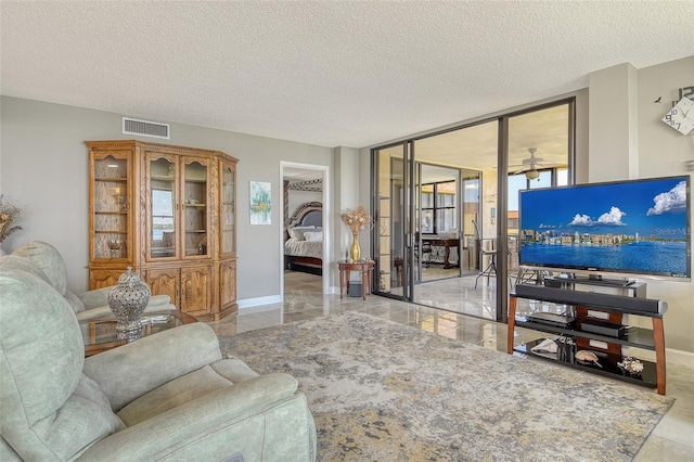 8779 Midnight Pass Rd Unit 506H, Sarasota, FL 34242 - living area with a textured ceiling and ceiling fan