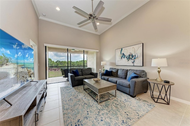 13710 Messina Loop Unit 201, Bradenton, FL 34211 - living area featuring light tile patterned floors, crown molding, a ceiling fan, baseboards, and a towering ceiling