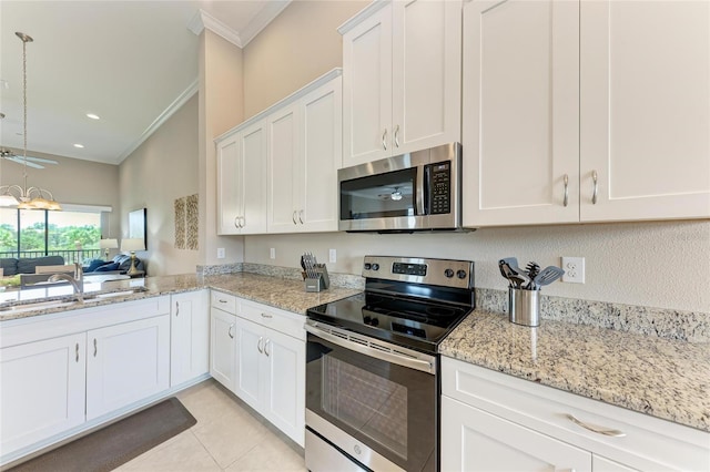 13710 Messina Loop Unit 201, Bradenton, FL 34211 - kitchen featuring stainless steel appliances, ornamental molding, white cabinets, light tile patterned flooring, and a sink