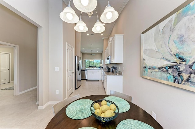 13710 Messina Loop Unit 201, Bradenton, FL 34211 - dining room featuring light tile patterned flooring and baseboards