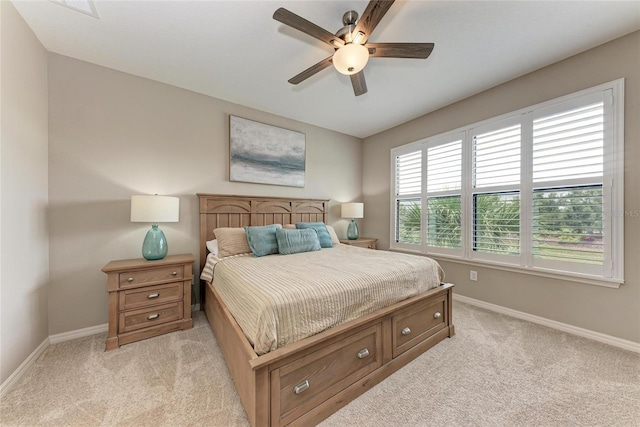 13710 Messina Loop Unit 201, Bradenton, FL 34211 - bedroom featuring light colored carpet, baseboards, and a ceiling fan