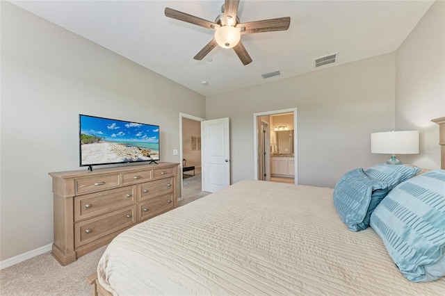 13710 Messina Loop Unit 201, Bradenton, FL 34211 - bedroom featuring baseboards, light carpet, ceiling fan, and ensuite bathroom