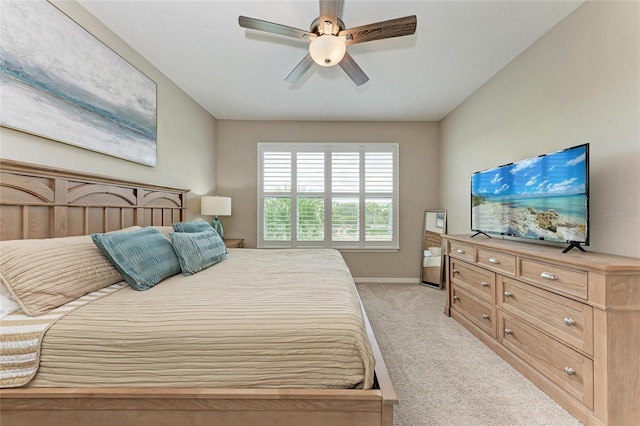 13710 Messina Loop Unit 201, Bradenton, FL 34211 - bedroom featuring light carpet, baseboards, and a ceiling fan