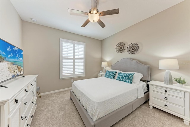 13710 Messina Loop Unit 201, Bradenton, FL 34211 - bedroom featuring light carpet, baseboards, and ceiling fan