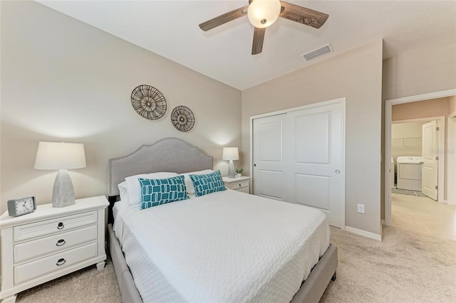13710 Messina Loop Unit 201, Bradenton, FL 34211 - bedroom with washer / dryer, light colored carpet, a closet, baseboards, and a ceiling fan