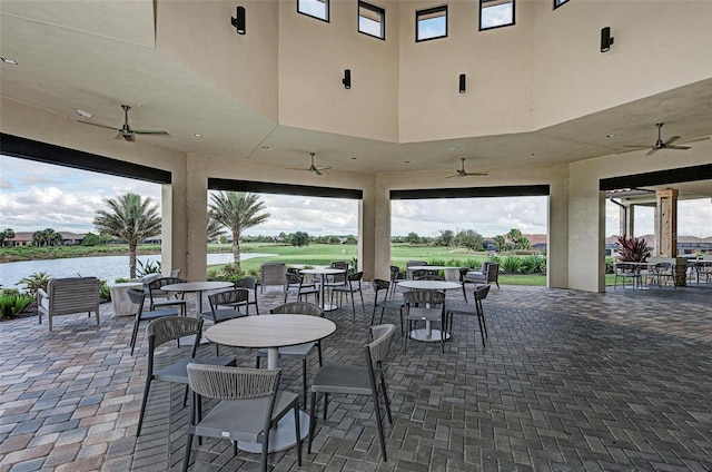 13710 Messina Loop Unit 201, Bradenton, FL 34211 - view of patio / terrace featuring a ceiling fan, a water view, and outdoor dining area