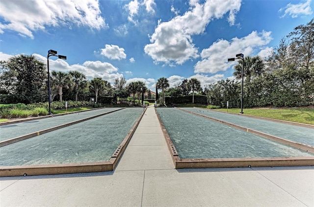 13710 Messina Loop Unit 201, Bradenton, FL 34211 - view of community with a game area and view of scattered trees