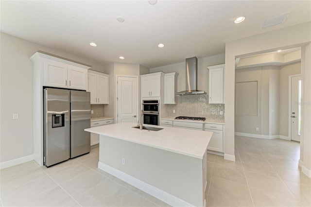 4210 Sea Marsh Pl, Parrish, FL 34219 - kitchen featuring appliances with stainless steel finishes, wall chimney exhaust hood, backsplash, white cabinetry, and light countertops