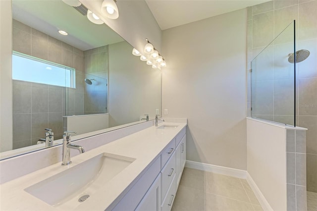 4210 Sea Marsh Pl, Parrish, FL 34219 - bathroom with double vanity, a walk in shower, and tile patterned floors