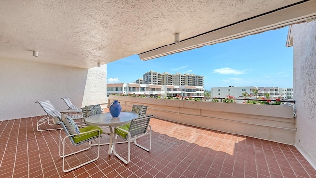 1465 Gulf Of Mexico Dr Unit 502, Longboat Key, FL 34228 - view of patio / terrace with a balcony