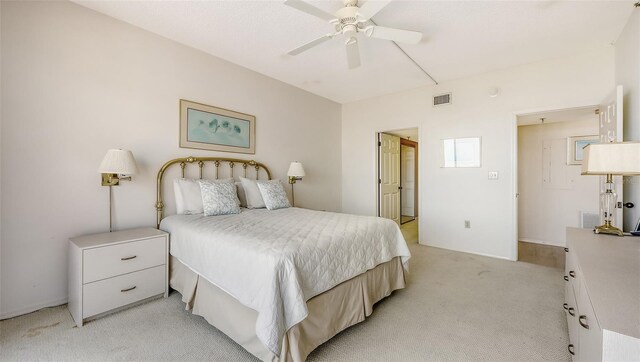 1465 Gulf Of Mexico Dr Unit 502, Longboat Key, FL 34228 - bedroom featuring light carpet and a ceiling fan