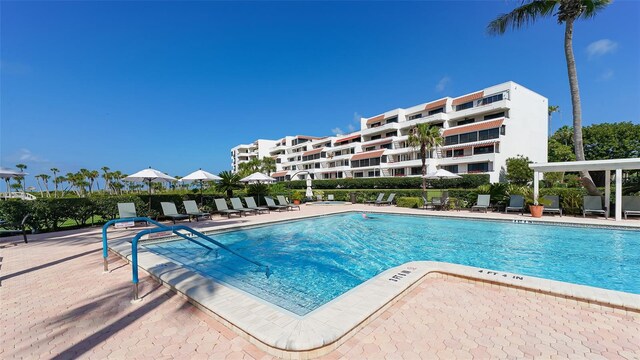 1465 Gulf Of Mexico Dr Unit 502, Longboat Key, FL 34228 - community pool featuring a patio area