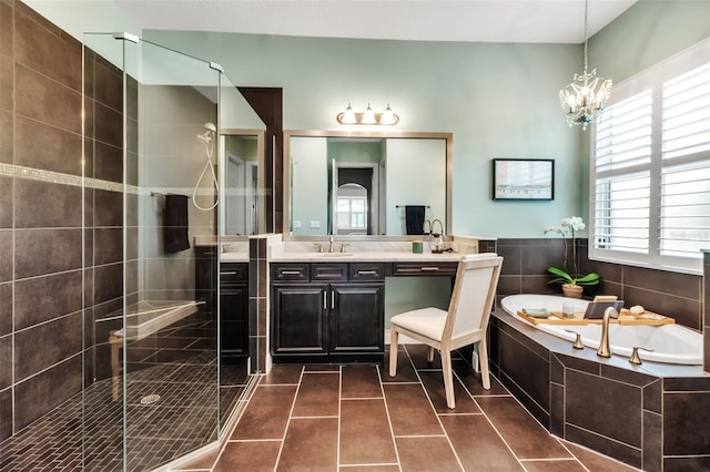 932 Mangrove Edge Ct, Bradenton, FL 34208 - bathroom featuring a bath, a shower stall, double vanity, a chandelier, and tile patterned floors