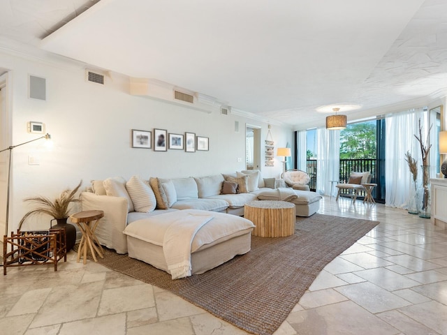 5880 Midnight Pass Rd Unit 207, Sarasota, FL 34242 - living room featuring expansive windows, stone tile flooring, and ornamental molding