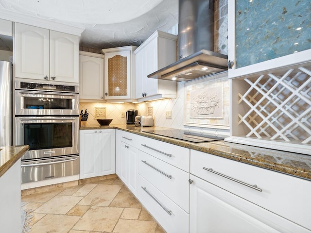 5880 Midnight Pass Rd Unit 207, Sarasota, FL 34242 - kitchen with wall chimney range hood, a warming drawer, appliances with stainless steel finishes, backsplash, and white cabinetry
