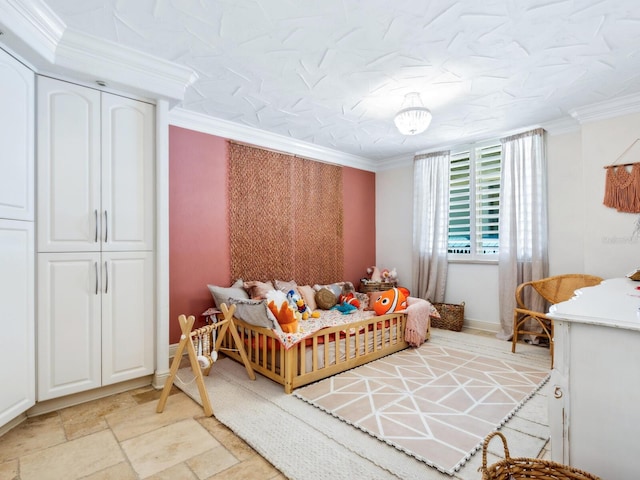 5880 Midnight Pass Rd Unit 207, Sarasota, FL 34242 - bedroom featuring crown molding, light stone finish floors, and baseboards