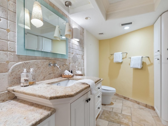 5880 Midnight Pass Rd Unit 207, Sarasota, FL 34242 - bathroom with vanity, baseboards, stone tile flooring, toilet, and recessed lighting