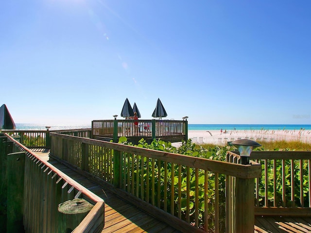 5880 Midnight Pass Rd Unit 207, Sarasota, FL 34242 - wooden terrace featuring view of water and beach