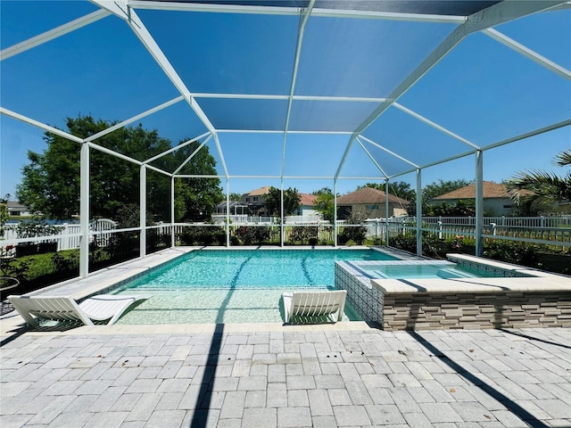 15207 Searobbin Dr, Lakewood Ranch, FL 34202 - view of swimming pool featuring a patio area, a pool with connected hot tub, and glass enclosure