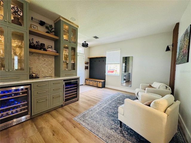 15207 Searobbin Dr, Lakewood Ranch, FL 34202 - indoor bar featuring wine cooler, light wood-style flooring, and baseboards