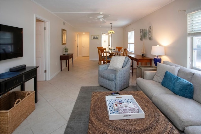 3745 Almeria Ave Unit 7S, Sarasota, FL 34239 - living room featuring ceiling fan, light tile patterned floors, and baseboards