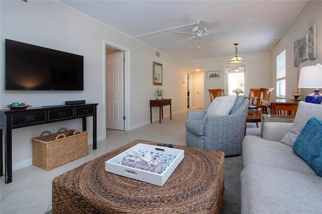 3745 Almeria Ave Unit 7S, Sarasota, FL 34239 - living area featuring ceiling fan, light tile patterned flooring, ornamental molding, and baseboards