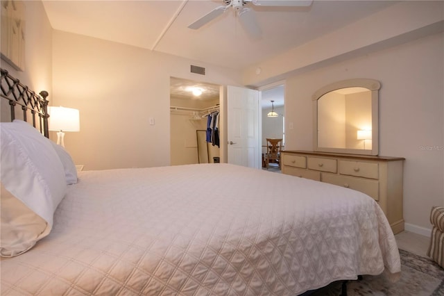 3745 Almeria Ave Unit 7S, Sarasota, FL 34239 - bedroom featuring a spacious closet, a ceiling fan, a closet, and baseboards