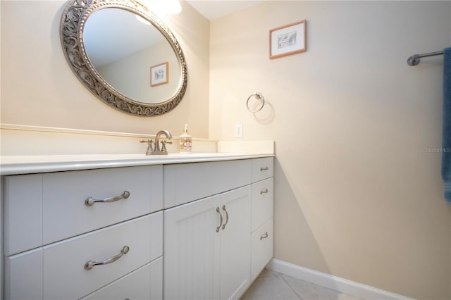 3745 Almeria Ave Unit 7S, Sarasota, FL 34239 - bathroom with vanity, tile patterned flooring, and baseboards