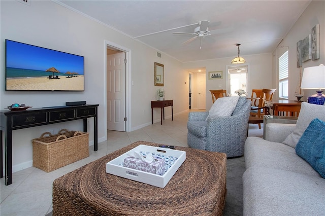 3745 Almeria Ave Unit 7S, Sarasota, FL 34239 - living area with light tile patterned flooring, a ceiling fan, crown molding, and baseboards