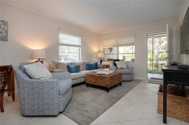 3745 Almeria Ave Unit 7S, Sarasota, FL 34239 - living area with light tile patterned floors, plenty of natural light, crown molding, and baseboards